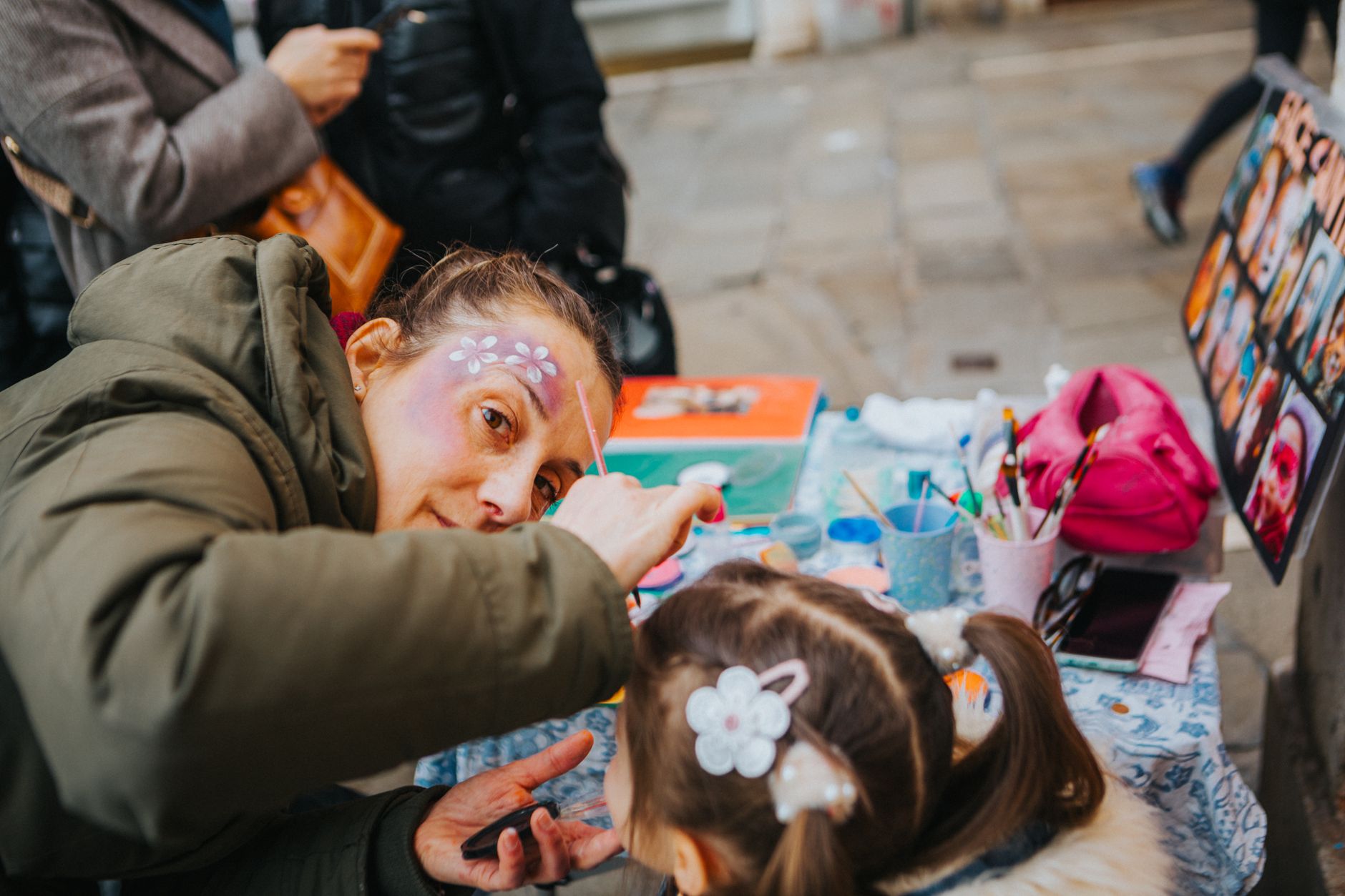 Face painting tutorial session with a child
